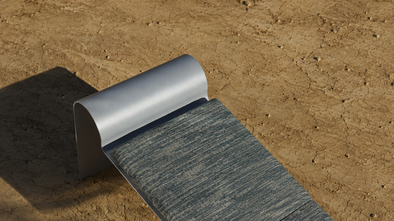 metallic bench on a sandy surface