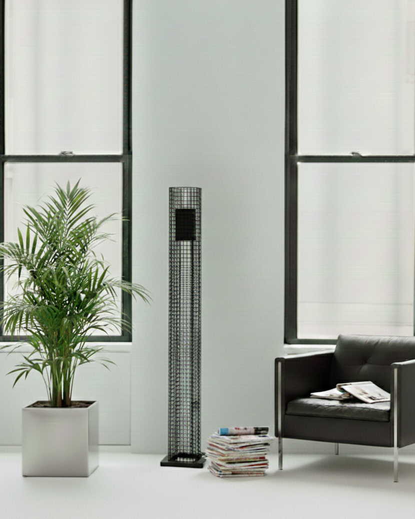 tall black metal mesh lamp with black leather sofa and palm plant in white loft
